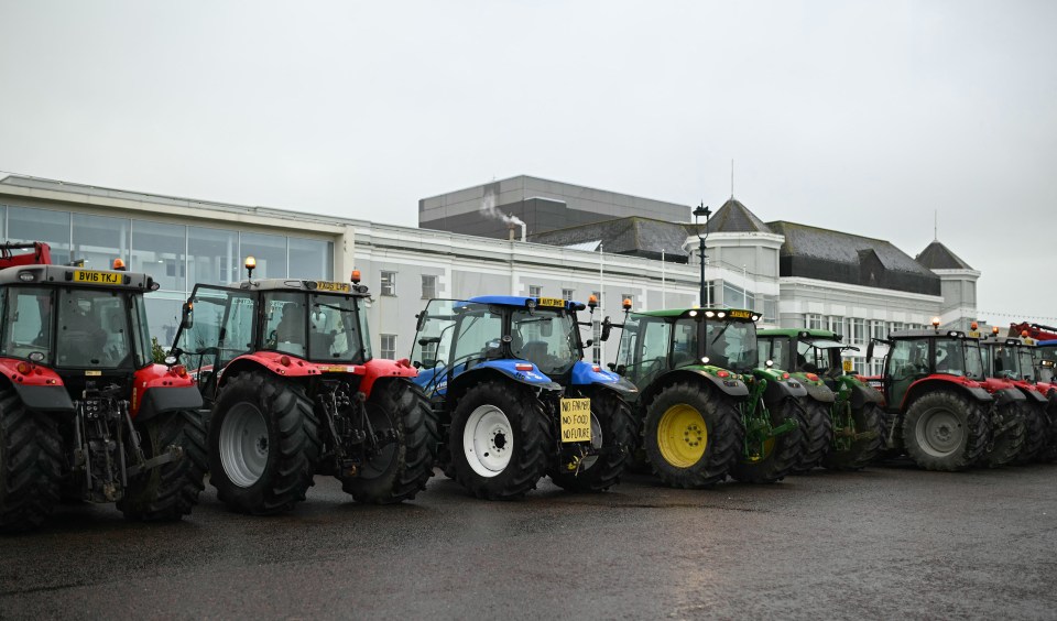 Tractors are seen lined up outside the venue