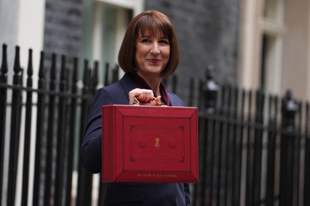 a woman holding a red briefcase that says secretary of the treasury