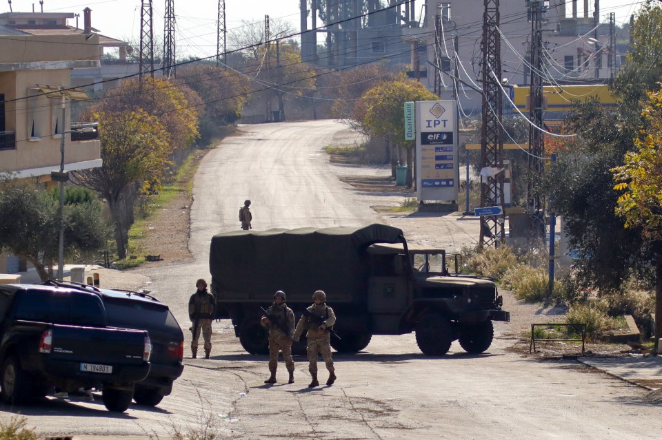 Lebanese soldiers use a military vehicle to block a road in southern Lebanon's Marjayoun area on Thursday