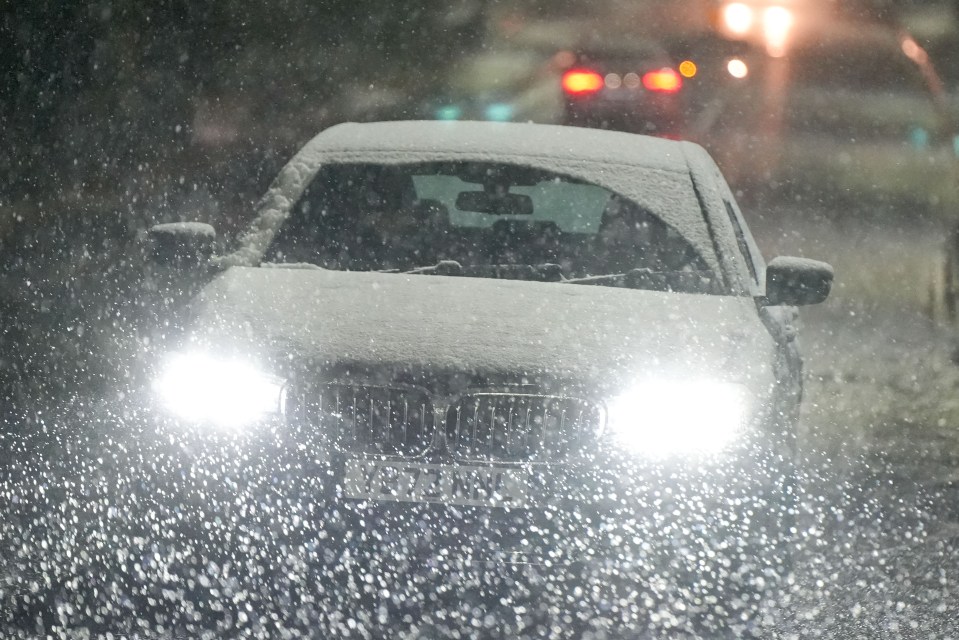 Cars battled through a snow storm in Huddersfield