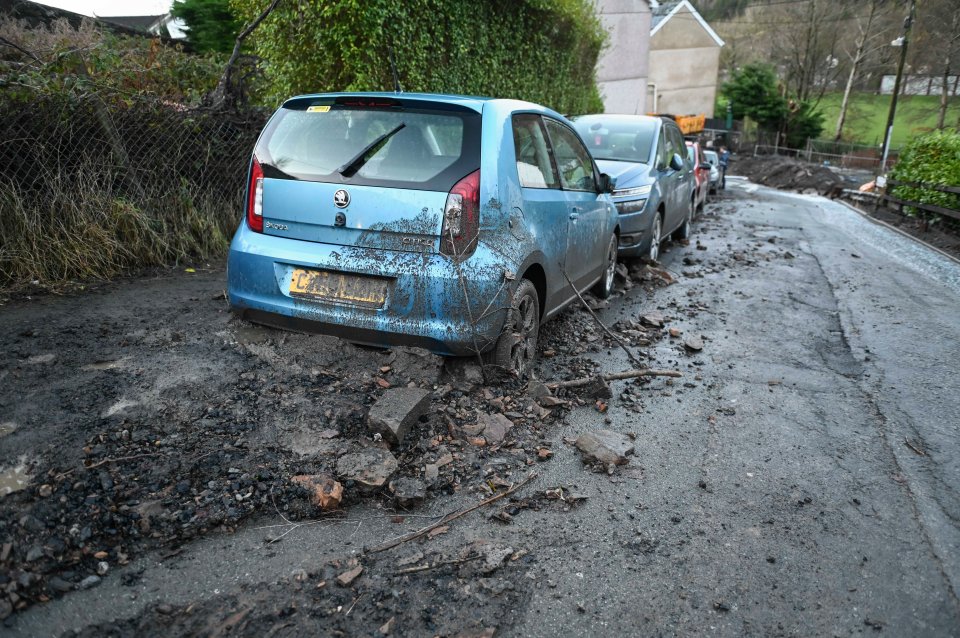 The Welsh town is deep in sludge and mud as water pours down a street