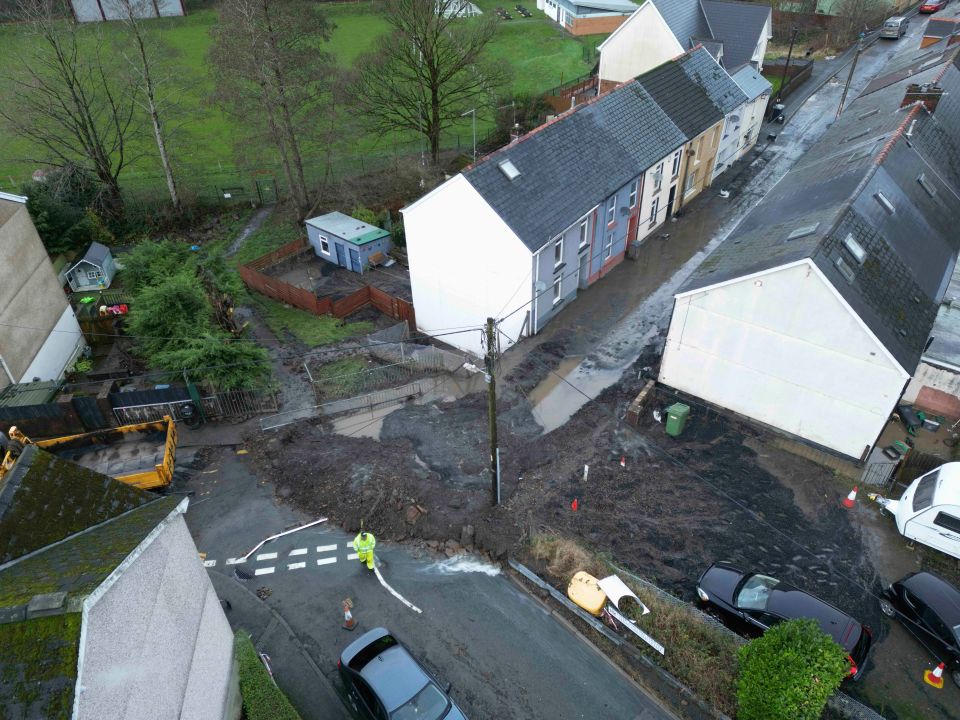 Workers desperately try to clear the landslide