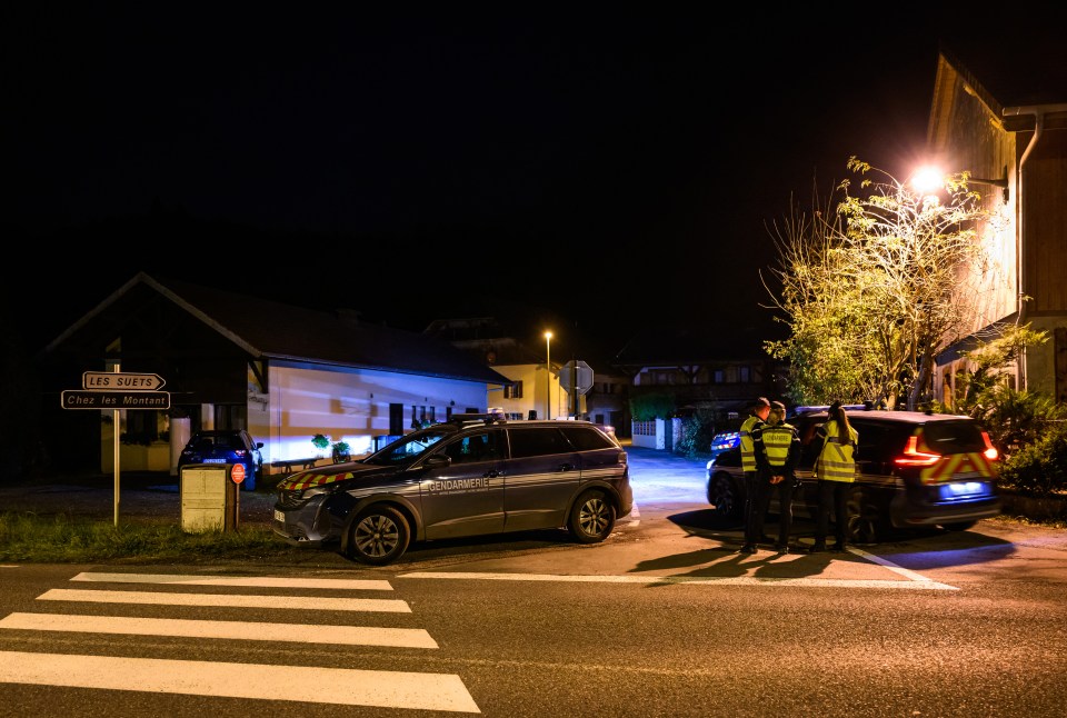 French gendarmes stand guard at the home in Taninges