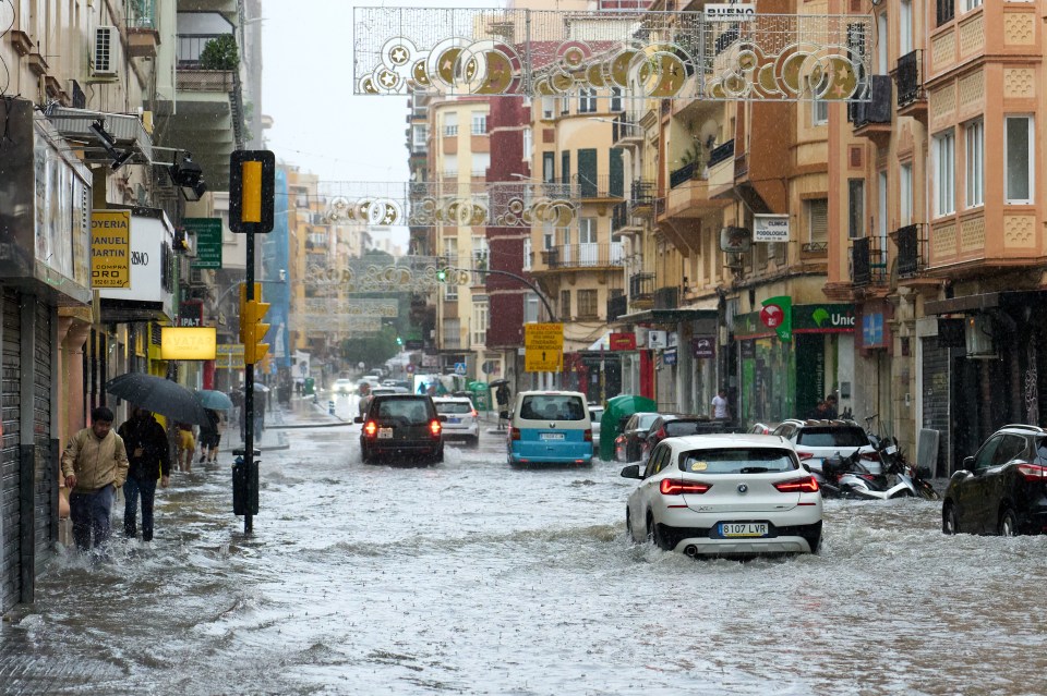 Car drive down a partially submerged road