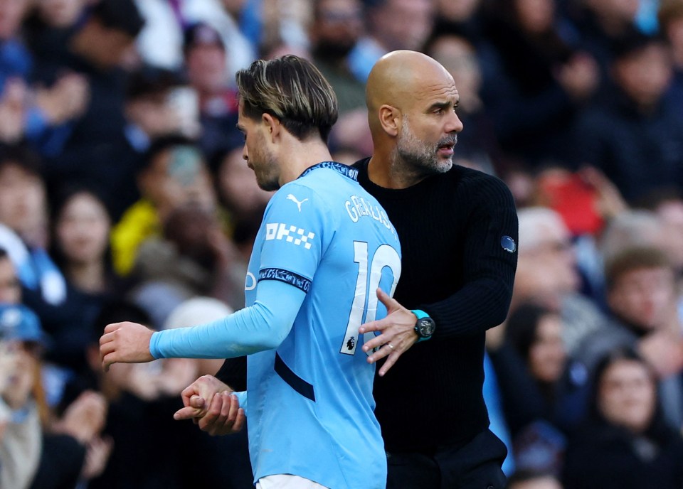 Jack Grealish with Man City boss Pep Guardiola