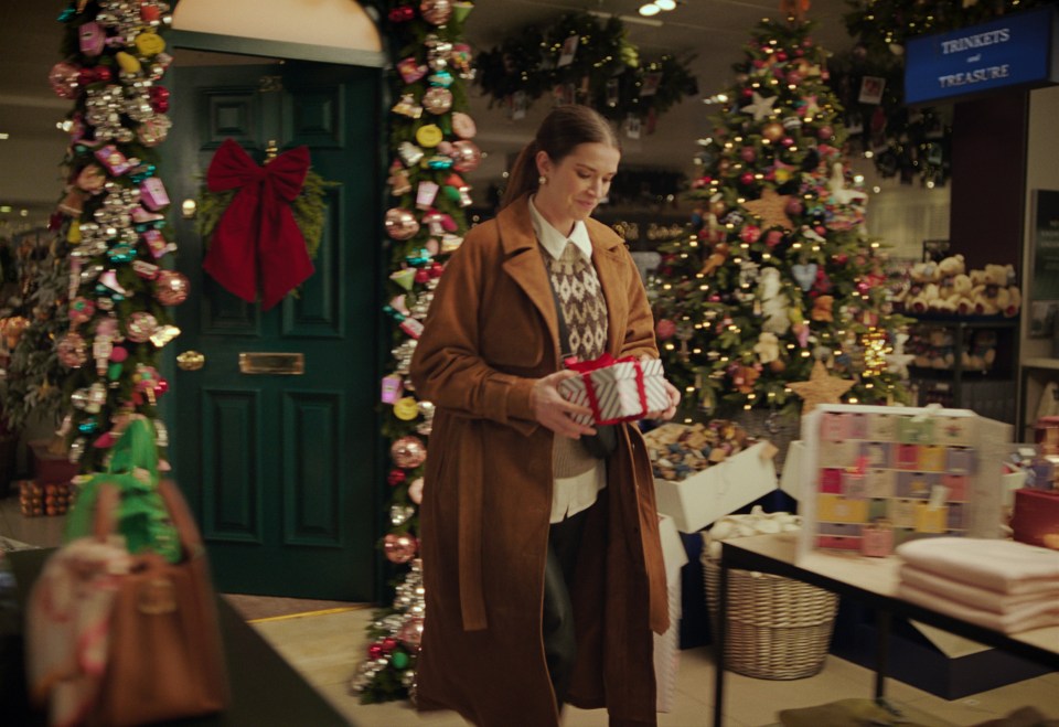 Sally returns to the present day and walks into the John Lewis Oxford Street shop with the gift wrapped and ready to go