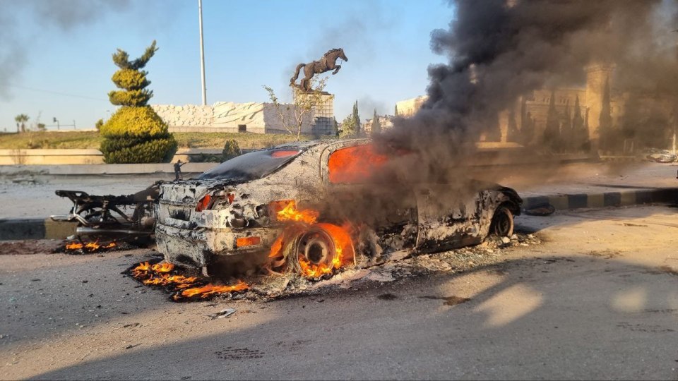 A wrecked car caught fire in the centre of Aleppo