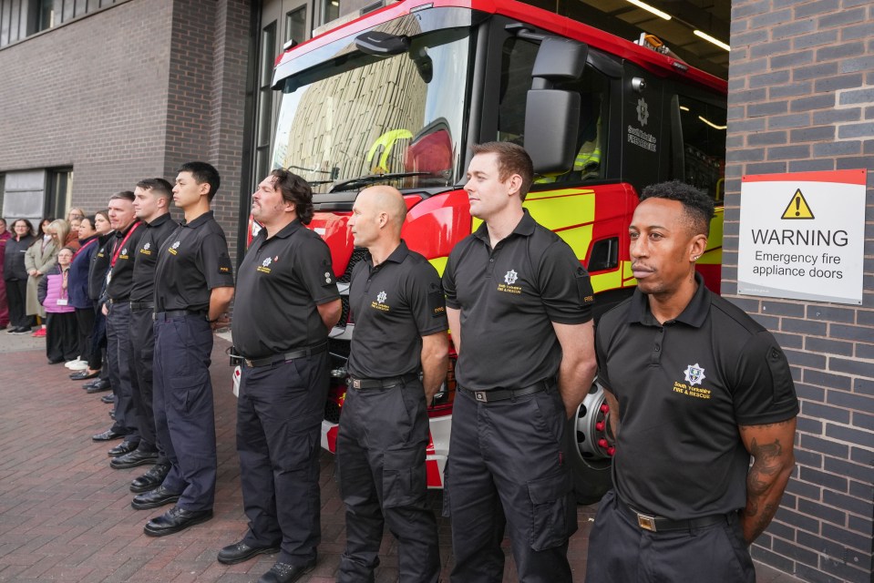 Firefighters at attention to pay their respects in Sheffield