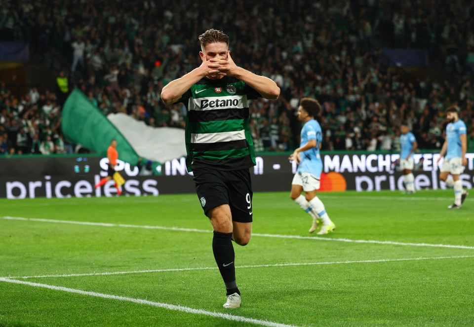 a soccer player wearing a betano jersey runs on the field