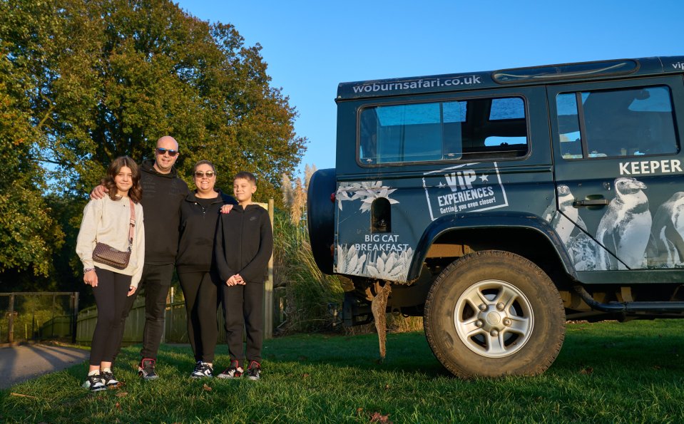 a family standing in front of a vehicle that says vip experiences