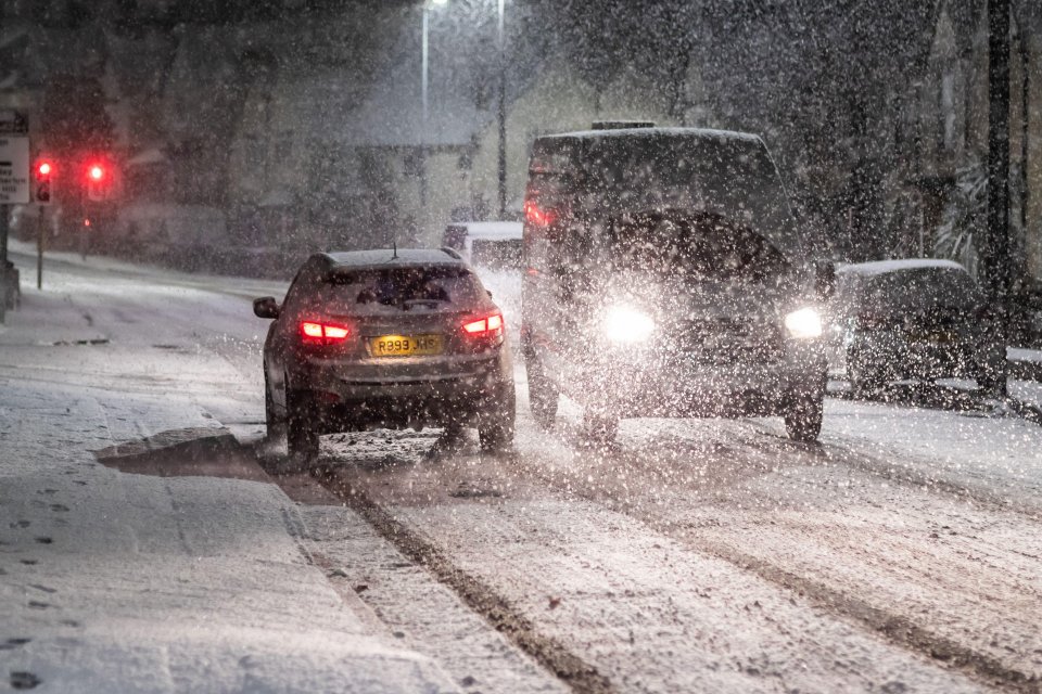 Vehicles struggled through the storm in Cradley Heath, West Midlands