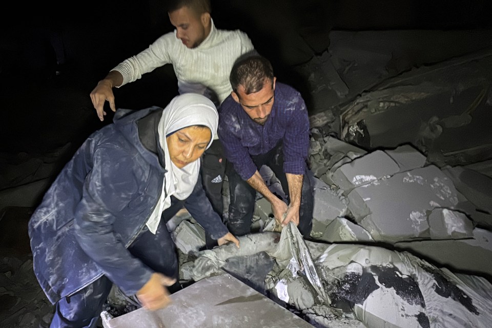 Civilians look for survivors in the rubble after an Israeli strike in the northern Gaza Strip