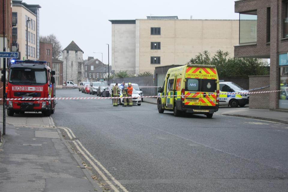 Emergency services at the scene where a woman fell to her death from a window