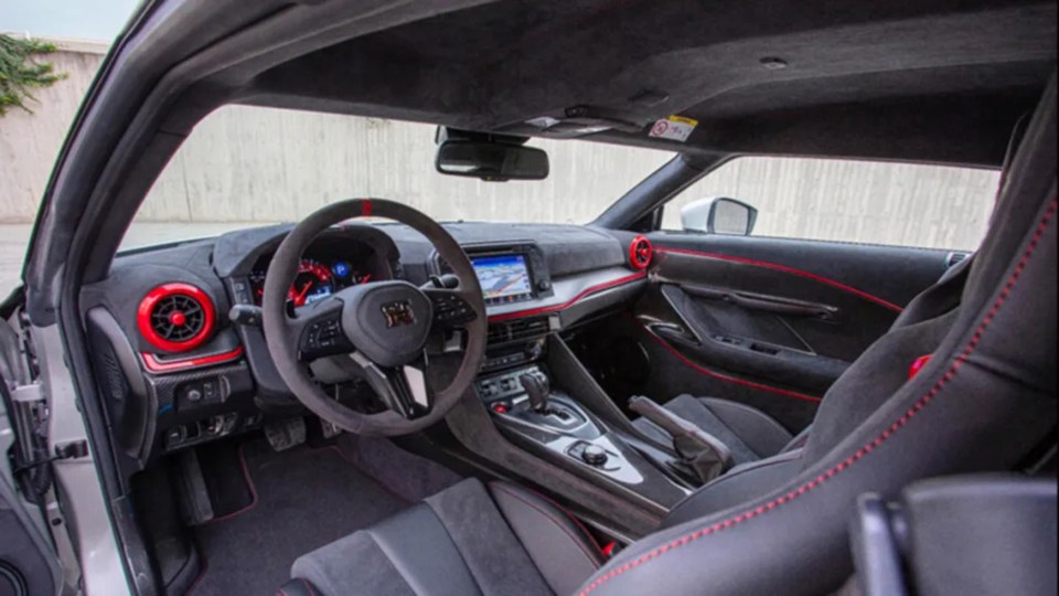 The interior is nearly identical to that of the GT-R, except for some Nismo Red accents