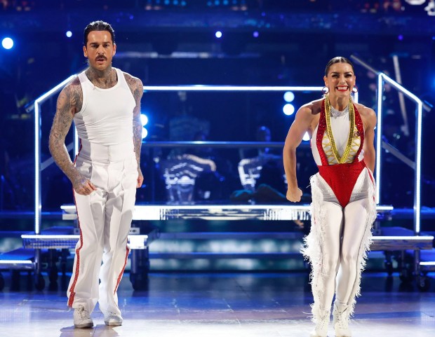 a man and a woman are dancing on a stage