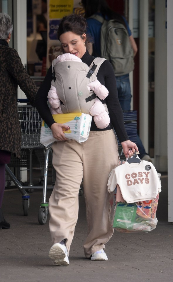 She looked relaxed and happy with her new bundle of joy