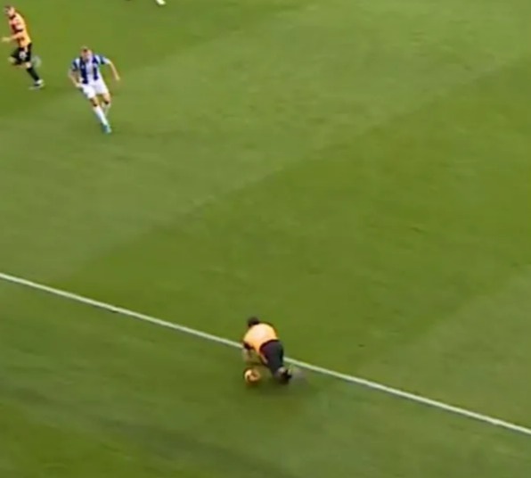 a group of soccer players are playing on a field