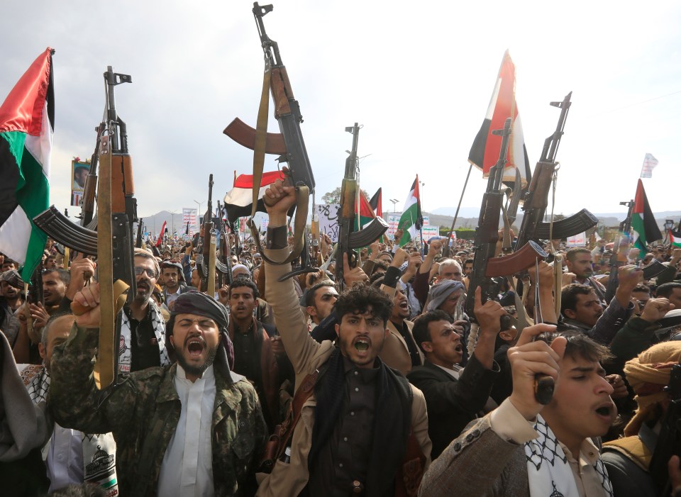 Houthi supporters chant during a protest against the US and Israel