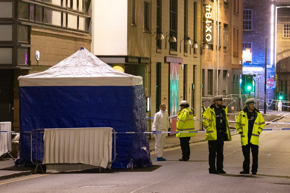 A blue tent erected within a police cordon in Cowgate