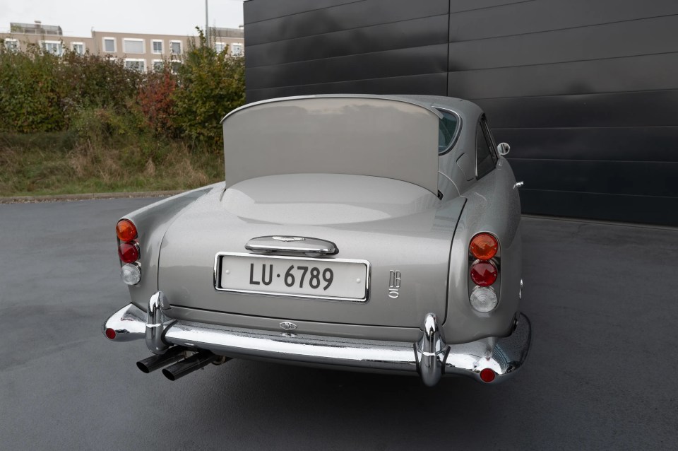 It include the famous bullet-proof metal shield that rises to cover the rear window