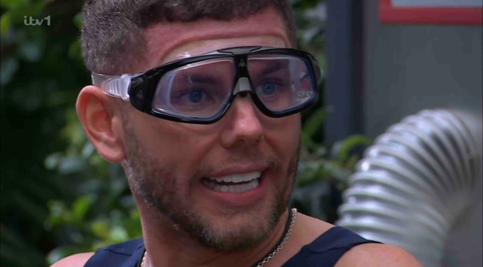 a man wearing goggles with itv1 written on the bottom