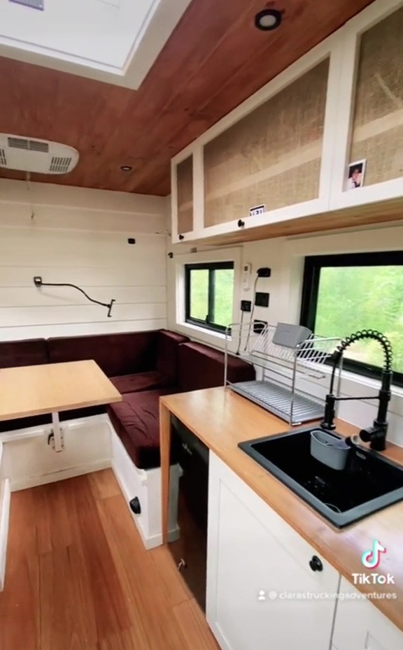 As well as having a gorgeous kitchen set-up, the couple can admire the sky through the window above their heads