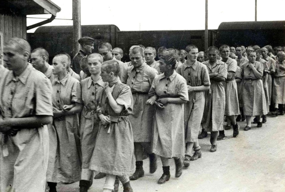 a row of framed pictures of prisoners including maria miedzyocha