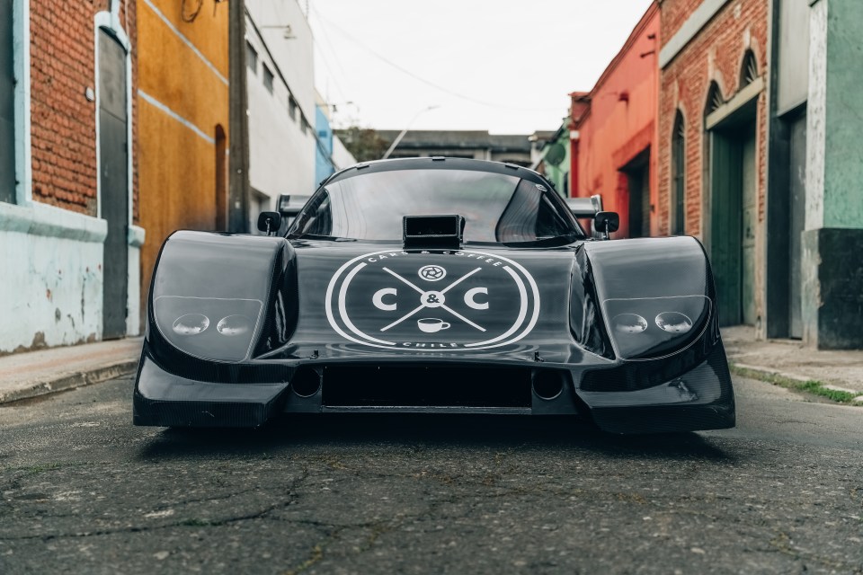 a black car with the letters cc on the front