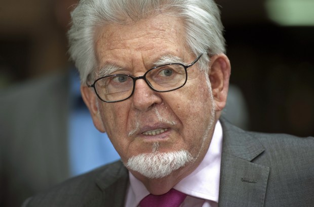 a man with glasses and a beard is being photographed by mark st george shutterstock