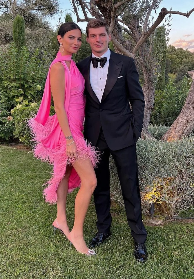 a man in a tuxedo stands next to a woman in a pink dress