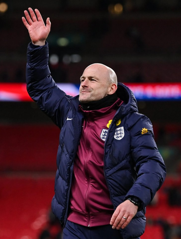 a man wearing a jacket that says england on it