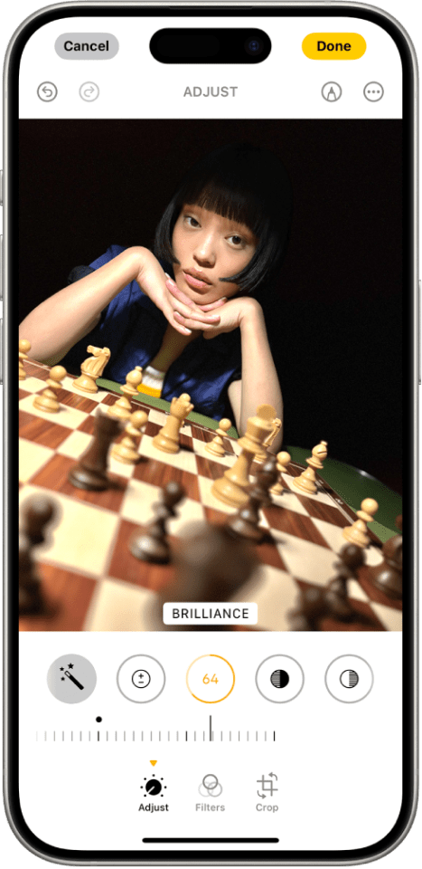 a cell phone with a picture of a girl on a chess board