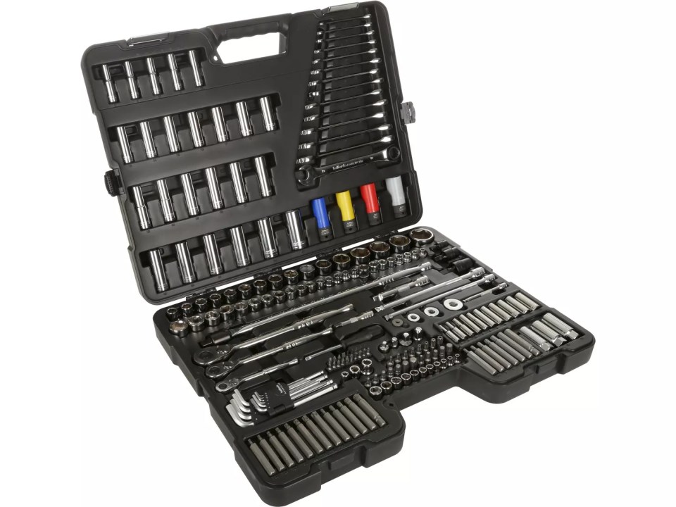 a set of sockets and wrenches in a black case