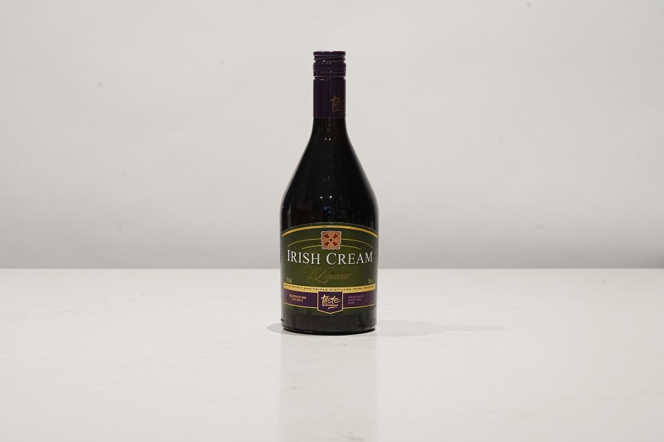 a bottle of irish cream liqueur sits on a white surface