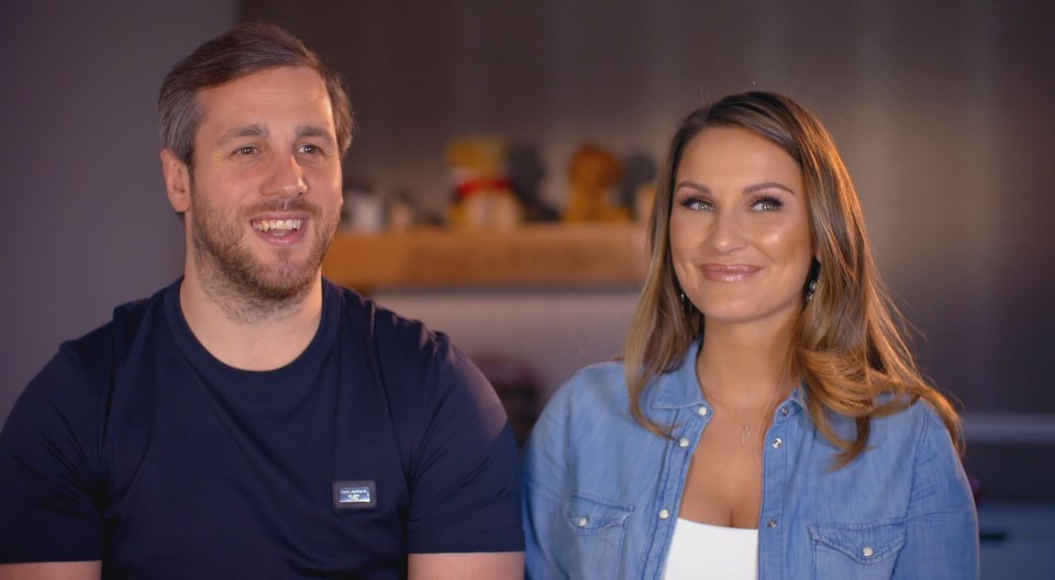 a man and a woman are standing next to each other and smiling