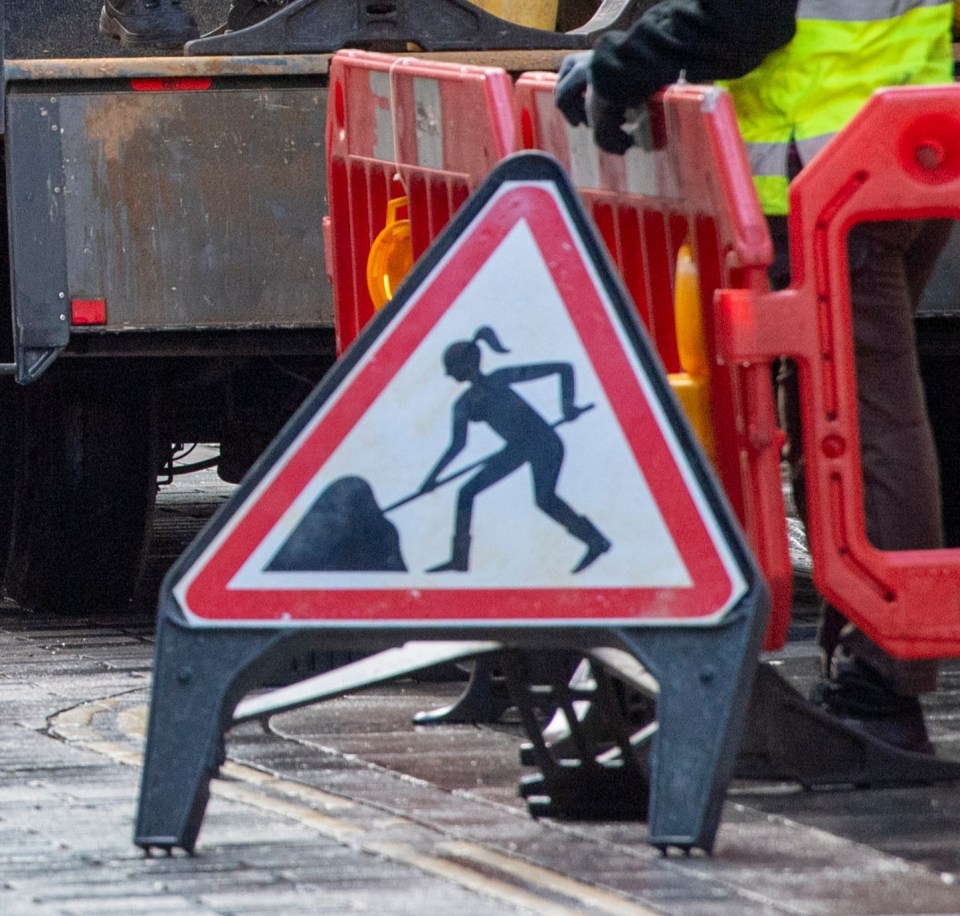 This fictional universe is dominated by women, pictured a 'women at work' road sign