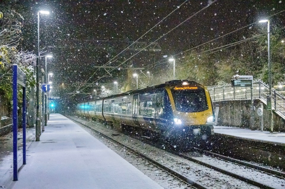 a train that has the word slough on the front of it