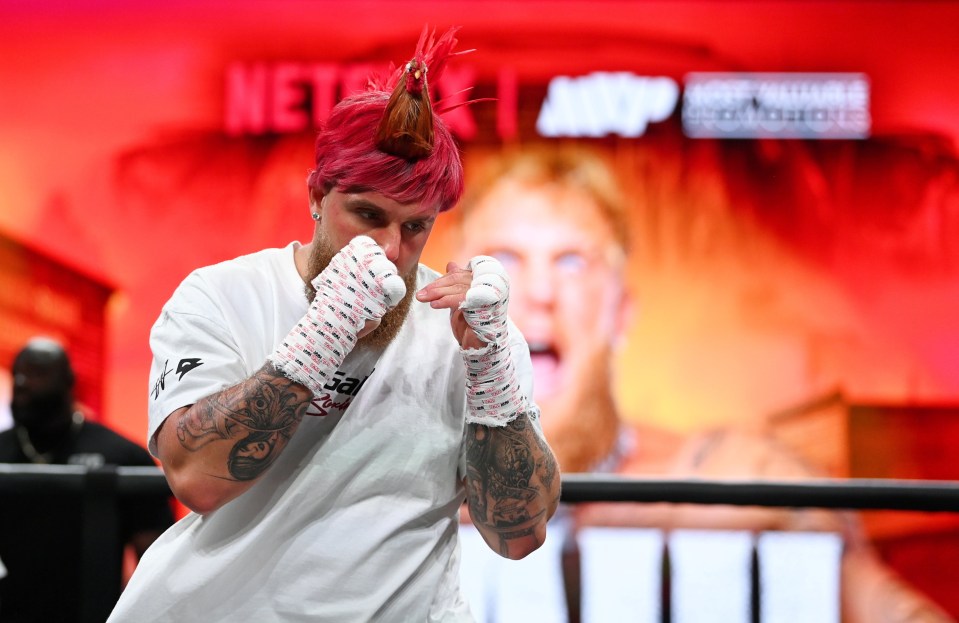 Jake Paul wears a rooster cap ahead of his fight with Mike Tyson