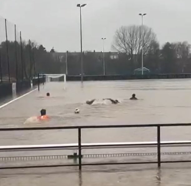 Non-league players enjoyed a swim after their pitch was flooded by Storm Bert