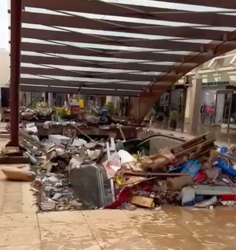 a flooded area with a lot of trash on the ground