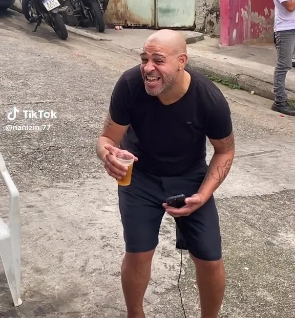 Adriano partied on the street with his friends