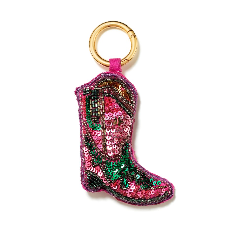 a keychain in the shape of a cowboy boot with sequins on it