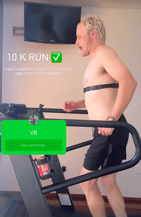 a shirtless man is running on a treadmill with a 10k run sign above him