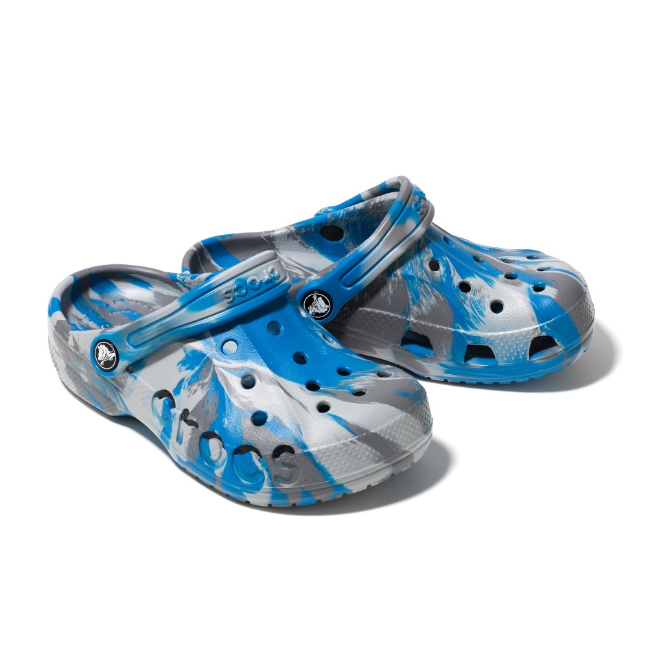 a pair of blue and gray crocs on a white background