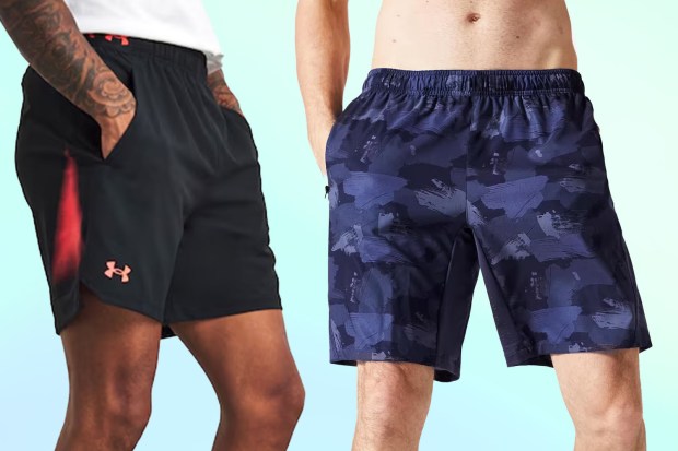 two men wearing under armour shorts are standing next to each other