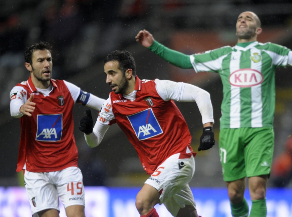 SC Braga's midfielder Ruben Amorim (C) celebrates with teammate midfielder Hugo Viana (R) after scoring a goal during the Portuguese league football match SC Braga vs Vitoria FC at the Municipal Stadium in Braga on January 20, 2013.  AFP PHOTO/ MIGUEL RIOPA        (Photo credit should read MIGUEL RIOPA/AFP via Getty Images)