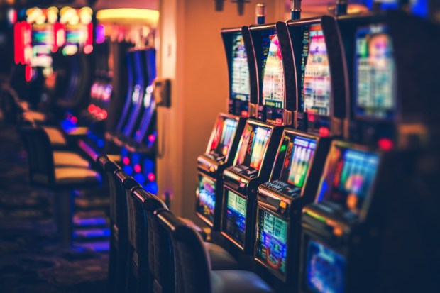 Rows of Casino Slot Machines with Shallow Depth of Field. Las Vegas Gambling Theme.