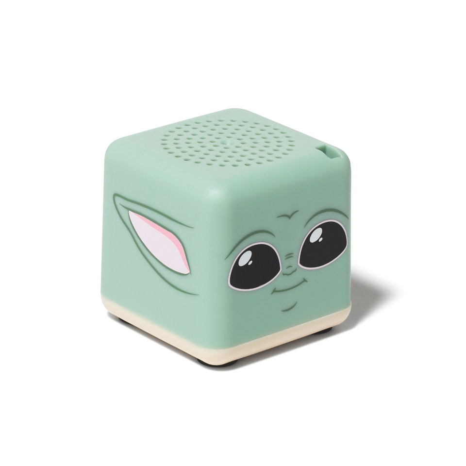 a green cube with a baby yoda face on it