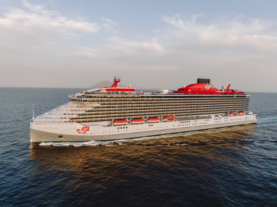 a virgin cruise ship is floating in the ocean