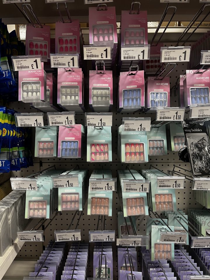 a display of fake nails with a price tag of 1.50